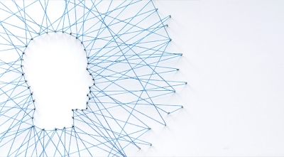 A person's head made out of pins and threads