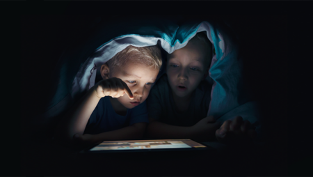 Children looking at iPad