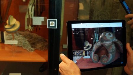 A person taking a screenshot of a helmet in a museum