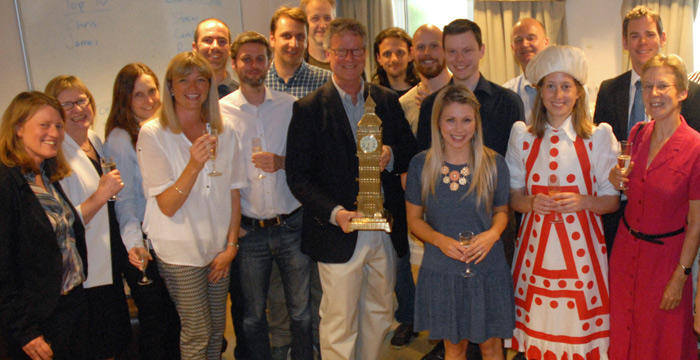 People gather for a picture at William Dutton's leaving drinks.]