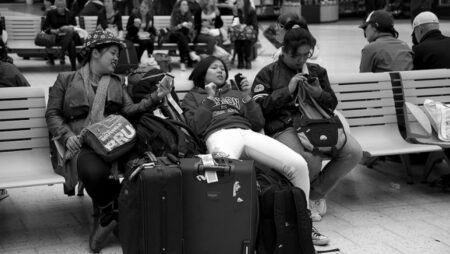 People wait at an airport.
