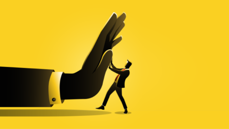 Giant hand pushing man
