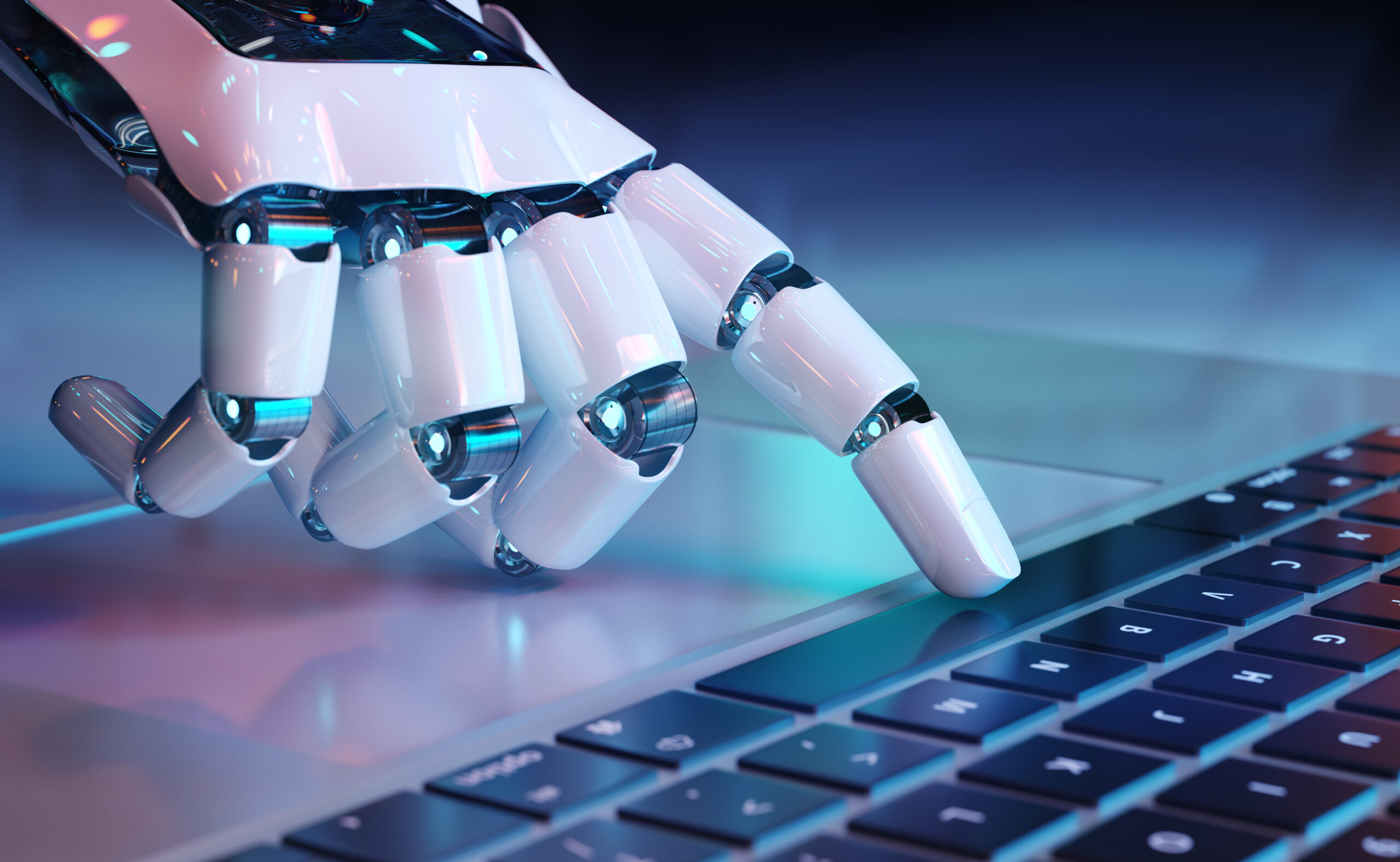 Robotic hand typing on a laptop keyboard