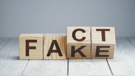 Letters saying 'fact' and 'fake'