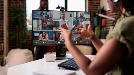 Woman speaking to people remotely via an online meeting